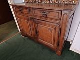 a wooden cabinet with a mirror on top of it