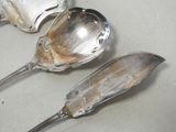 three spoons that are sitting on a table