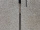 a lamp that is on top of a metal stand