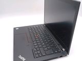 a black laptop computer sitting on a white surface