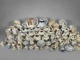 many different types of vases and bowls on the table