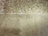 a stone block with writing on it on a table
