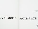 an open book with a black and white image on it