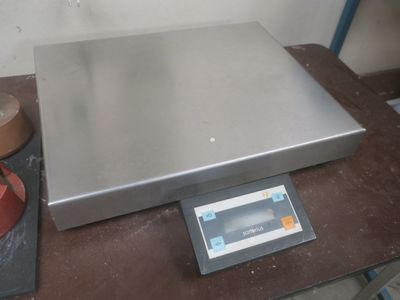 an image of a scale on a table in a room