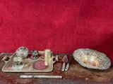 a silver tray with silver objects on it on a wooden table