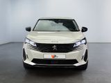 the front view of a white car in a white room