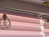 four light bulbs hanging from the ceiling of a room