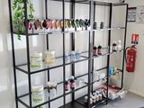 a room with a bunch of shelves that have various items on them