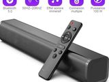 a close up of a remote control sitting on top of a speaker