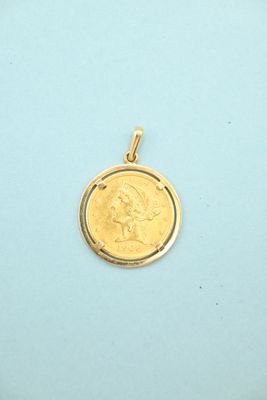 an image of a gold coin with a woman ' s face on it