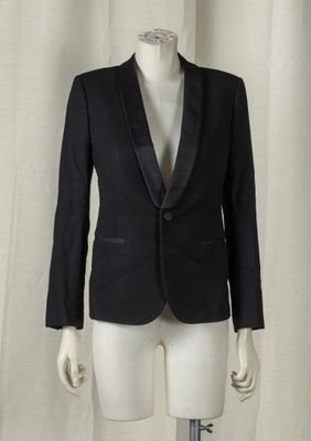 a mannequin wearing a black suit on a white mannequin