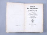 an open book with a black and white title on a blue background