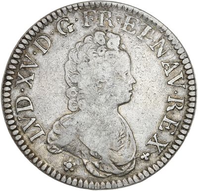 une pièce d'argent portant une tête de femme et une couronne