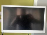 a television that is on a stand in a room