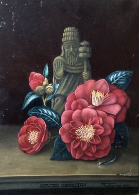 une photo représentant un tableau de fleurs et une statue de Bouddha