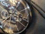 a close up of a watch on the wrist of a person