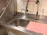 a sink in the kitchen with a towel on the counter