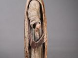 an image of a statue of a man with a hat and cloak