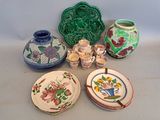 many plates and bowls that are sitting on a table