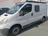 a white van parked in a parking lot next to a building