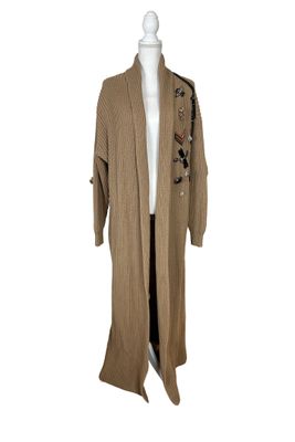 the coat is brown and has a floral design on it