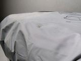 an image of a bed with a sheet covering it