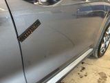 a close up of a car door with a sticker on it
