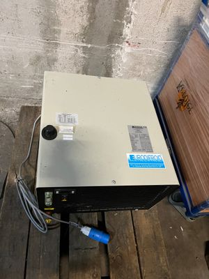 an image of a metal box sitting on top of a wooden pallet