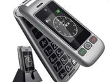 an image of a cell phone with a clock on top of it