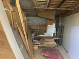 a room with a lot of wood on the floor