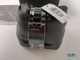 a watch that is attached to the back of a cell phone