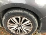 a close up of a tire on a car ' s rim