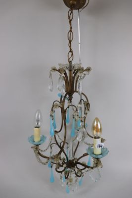an image of a chandelier with three lights hanging from it ' s ceiling