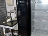 an image of a refrigerator and a table in a room