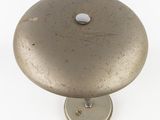 an image of a metal knob with a hole in it
