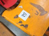a red object on the table next to a yellow object