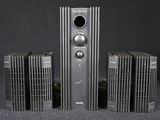 four speakers that are sitting on a table