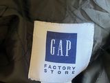 a label on a jacket that says gap factory store