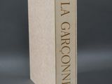 the book is sitting on top of a table with a gray background