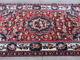 rug on the floor with a red background and a black background