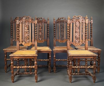 three antique wooden chairs with carved back and seat cushions