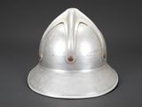an old silver helmet on a gray background