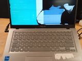 a laptop that is sitting on a table with a keyboard