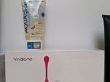 a toothbrush and toothpaste in a box on a table