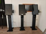 three televisions that are sitting in a room