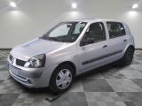 a picture of a small silver car parked in a garage
