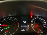 a close up of a car dashboard with various gauges