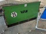 a green box sitting in the middle of a warehouse