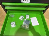 a close up of a green tool box filled with screws and nuts