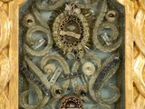 an image of a gold clock with a clock face surrounded by jewels